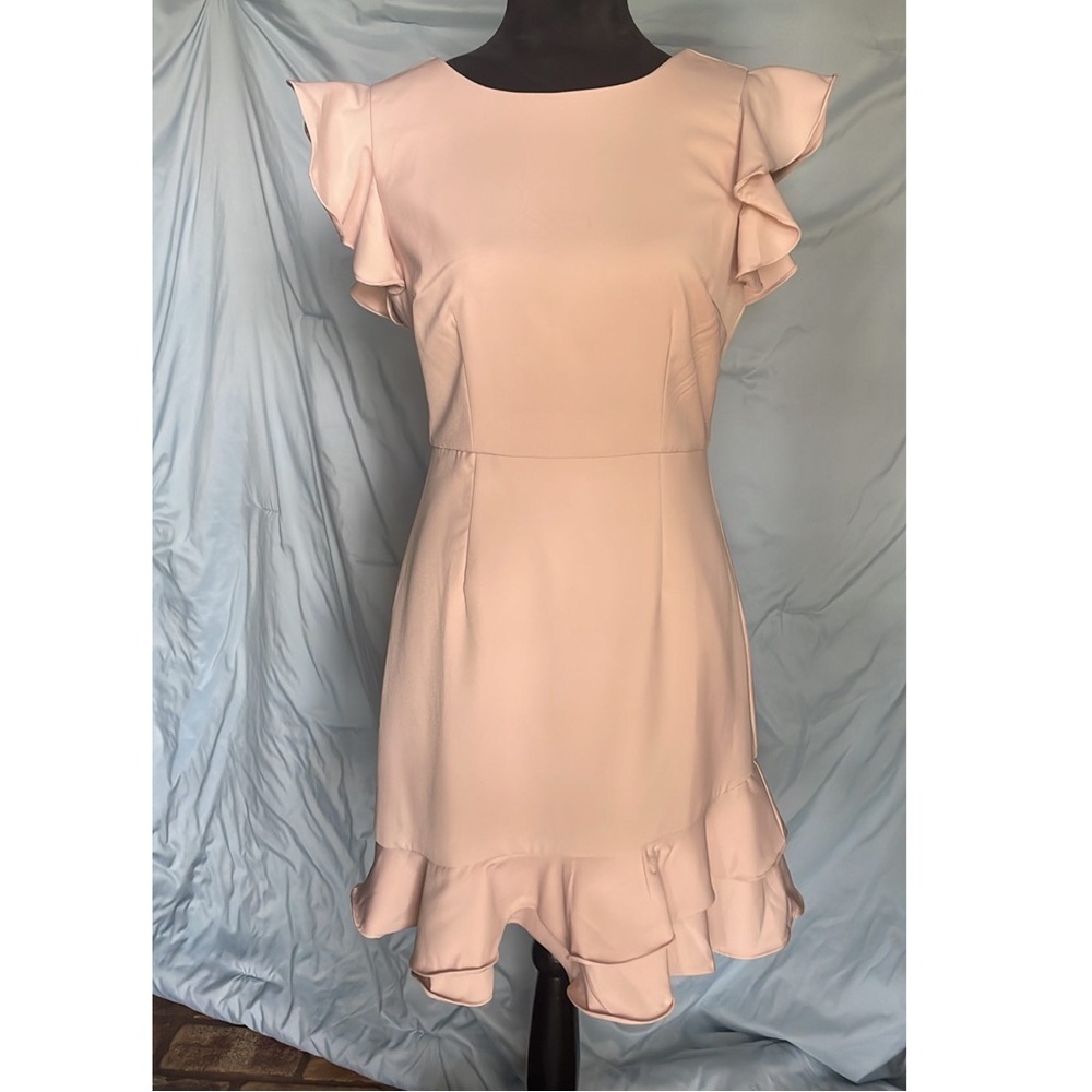 Light pink blush colored dress with ruffle skirt and straps